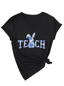 Detail of V-neck black T-shirt featuring blue floral TEACH print and rabbit graphic