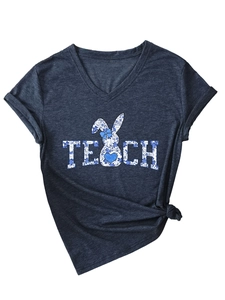 Detail of grey V-neck T-shirt showing TEACH text and blue floral bunny graphic