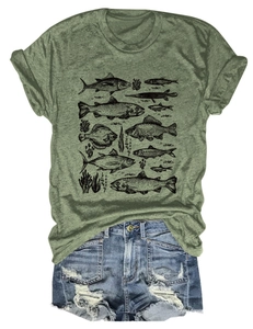 Detail of olive green t-shirt with fish print and distressed denim shorts