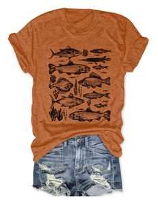 Flat lay of rust orange t-shirt with vintage fish and seaweed print with denim shorts