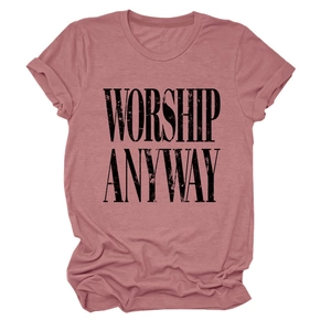 Close-up of the dusty rose T-shirt fabric featuring the black WORSHIP ANYWAY print