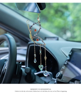 Detail of butterfly suncatcher with colorful crystals and wire-wrapped beads car decor