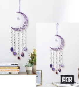 Detail of purple crescent moon dreamcatcher with crystal chips for wall decoration