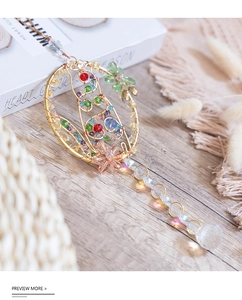 Macro shot of colorful crystal beads and suncatcher pendant with sparkling glass prisms