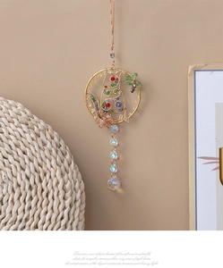 Macro detail of handmade cat charm with colorful beads and faceted crystal ball pendant