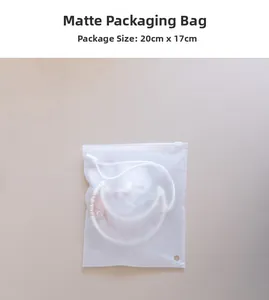Frosted packaging bag 20x17cm with white accessory inside on a neutral background