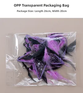Detail of star-shaped dream catcher with purple stones and feathers in 26x20cm packaging