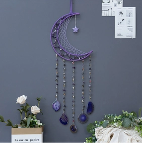Detail of purple moon dreamcatcher with amethyst stones and natural agate slices
