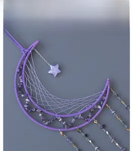 Detail of purple moon dreamcatcher with amethyst stones and hanging crystal chains