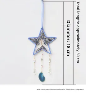 Dettaglio acchiappasogni stella albero della vita con cristalli blu e fette d'agata