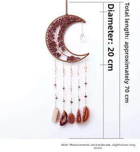 Detail of moon-shaped crystal wall hanging with dimensions of 20cm by 70cm
