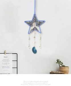 Dettaglio decorazione murale Albero della Vita a stella con cristalli blu e agata