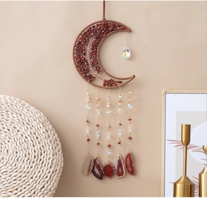 Detail of bohemian red stone tree of life wall decor with moon frame and agate slices