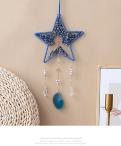 Acchiappasogni a forma di stella con albero della vita e scaglie di pietra blu