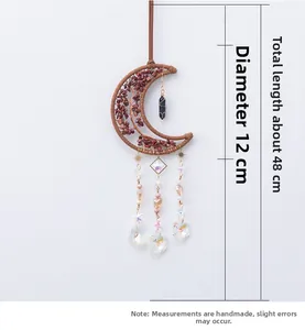 Bohemian moon dream catcher detail with reddish crystal stones and iridescent pendants