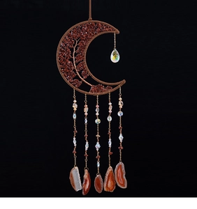 Detailed wall hanging with tree of life moon frame and natural agate slices