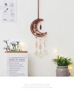 Detail of tree of life crescent moon wall hanging with aura crystal pendants