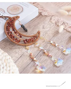 Detail of crescent moon tree of life wall hanging with natural red stones and crystal beads
