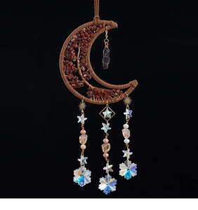 Detail of moon-shaped Tree of Life wall hanging with natural red stones and crystal snowflakes