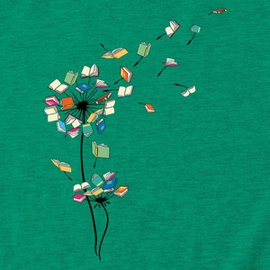 Close-up of dandelion print with flying books on green cotton fabric of a T-shirt