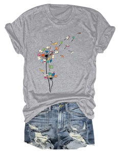 Detailed flat lay of dandelion book print on grey cotton t-shirt and denim shorts