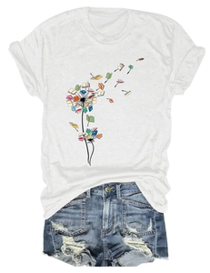 Flat lay of white T-shirt with dandelion book print and distressed denim shorts