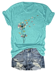 Flat lay of casual blue T-shirt with dandelion book print and distressed denim shorts