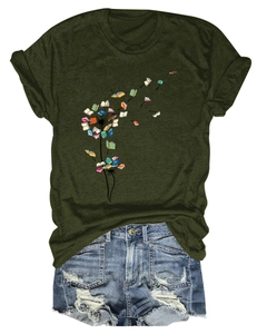 Detail of creative dandelion book print on olive green short sleeve t-shirt and denim shorts