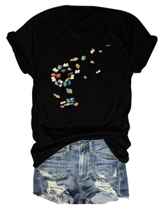 Detail of crew neck T-shirt featuring artistic dandelion book print and denim shorts