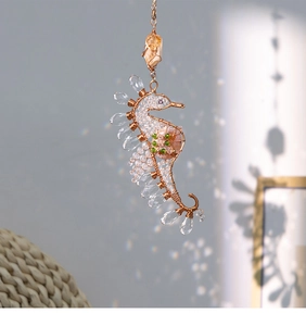 Detailed wire-wrapped seahorse ornament with crystal droplets and natural citrine gemstone