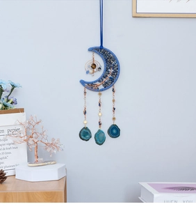 Detailed wall hanging with crescent moon lapis beads and blue agate slices decor