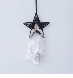 Detail showing crystal tree of life inside star frame with dangling moon and prism pendants