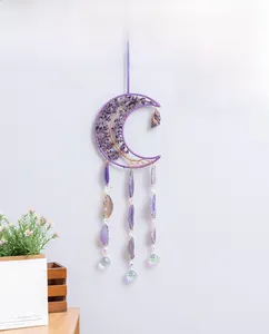 Detail of amethyst tree of life moon suncatcher with hanging agate slices and crystal ball
