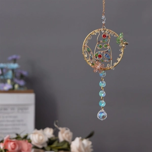 Handmade gold crystal suncatcher featuring a wire-wrapped cat and colorful beads for cars