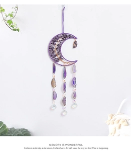 Detail of bohemian crescent moon suncatcher with purple amethyst and agate slices