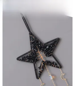 Detail of tree of life star suncatcher with black stones and crystal moon pendant