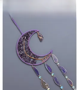 Close-up of bohemian crescent moon Tree of Life with purple amethyst and agate slices