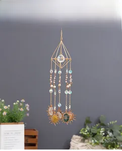 Close-up of crystal suncatcher with gold wire sun pendants and natural agate stones