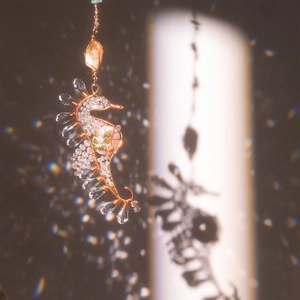 Handmade wire-wrapped seahorse pendant with crystal beads and boho suncatcher details