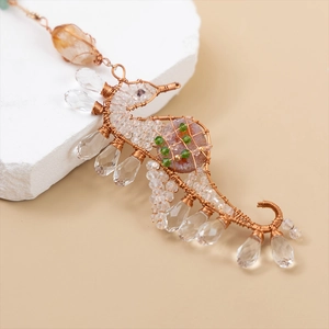 Handmade wire-wrapped seahorse pendant with brass finish and natural crystals
