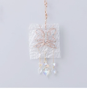 Detailed wire-wrapped butterfly suncatcher with blue beads and clear crystal heart pendants