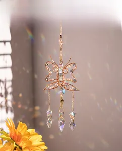 Bohemian sun catcher with wire-wrapped butterfly and crystal prisms creating rainbows