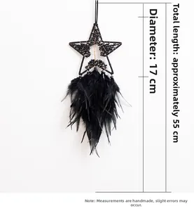 Detail of black star dream catcher with natural stones and hanging feathers, 55cm length
