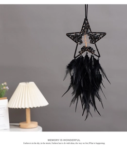 Detail of a handmade black pentagram dream catcher with Tree of Life crystal design
