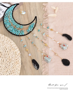 Detail of moon-shaped suncatcher with life tree crystals and turquoise hanging stones