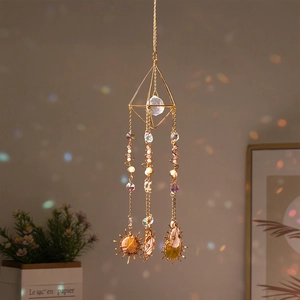 Golden suncatcher with natural agate slices and crystal prism for indoor decoration