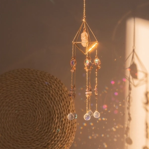 Bohemian suncatcher with golden octahedron frame and crystal prism reflecting rainbow light