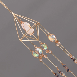 Handmade crystal suncatcher with gold geometric frame and iridescent moon prism accents
