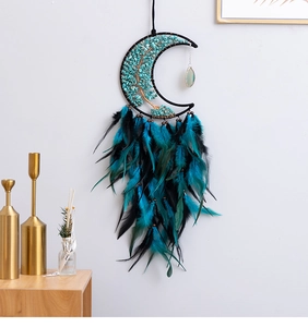 Moon-shaped dreamcatcher featuring turquoise tree of life and black feathers for wall decor