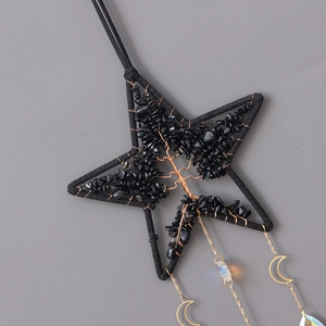 Star-shaped tree of life suncatcher with black stone chips and crystal moon pendants